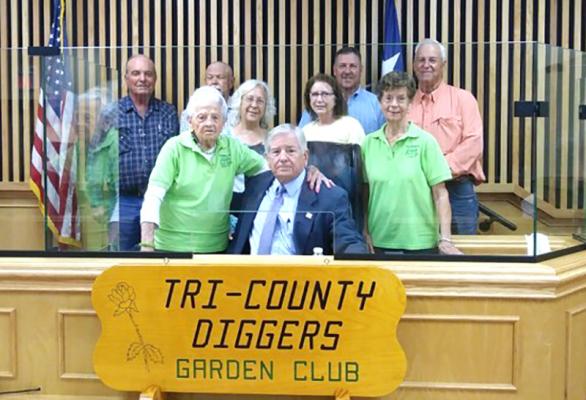 Members of the Tri-County Diggers Garden Club, including President Loraine Kuehn, Phyllis Isaac, Judy Wise and Marilyn Kropik, pose with Madison County Judge Tony Leago and Commissioners Ricky Driskell, Carl Wiseman, Carl Cannon and David Pohorelsky. COURTESY PHOTO