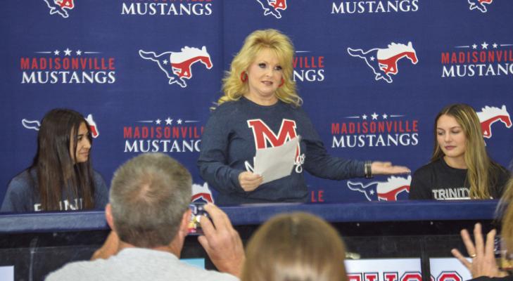 Coach Lori French with Zoee Newton and Jaylen Downard during their signing on Tuesday, March 28.