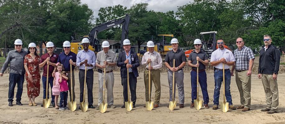 President Jack Hunter, CEO Joel Shaw, Major Bill Parten, Judge Osborne, City Manager Fabrice Kabona, and members of the construction committee at the ground-breaking ceremony for Normangee State Bank in Madisonville.