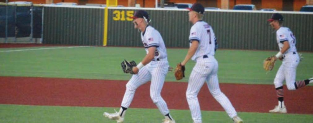 Centerfielder Cody Stapleton celebrates with starting pitcher Rayce Hudson after throwing out a Robinson baserunner at the plate in the third inning of Friday’s 8-2 win over Robinson at MHS to start district play. CAMPBELL ATKINS