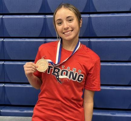 Grace Coleman with her 4th place medal at Region 3 4A Texas High School Women’s Powerlifting Association contest at Pine Tree High School. COURTESY PHOTO